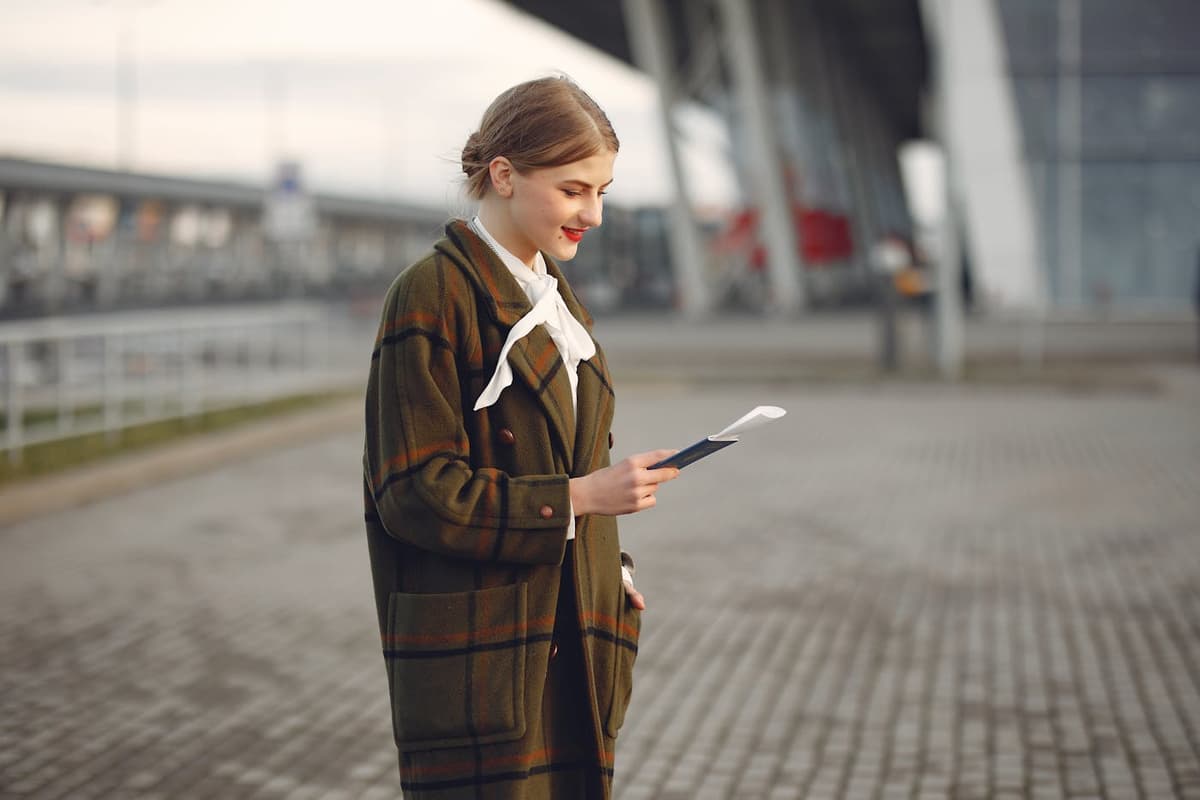 Russian fiancée at airport with passport — K-1 fiancée visa process illustration
